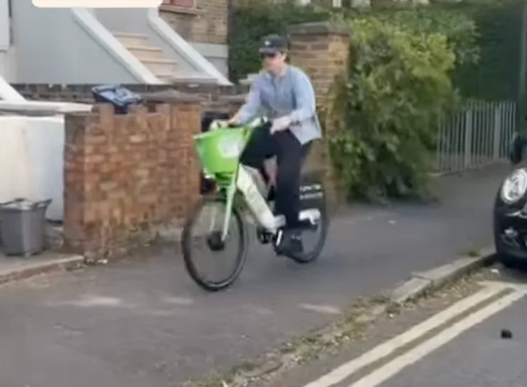 Cyclist using the pavement on Greenwood Road